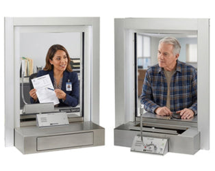 2 persons communicating through a glass window by window intercom by HavenTech Intercoms