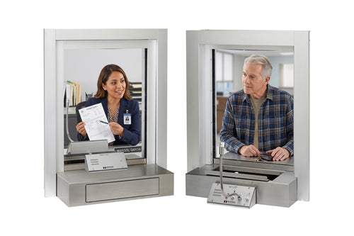 2 persons communicating through a glass window by window intercom by HavenTech Intercoms